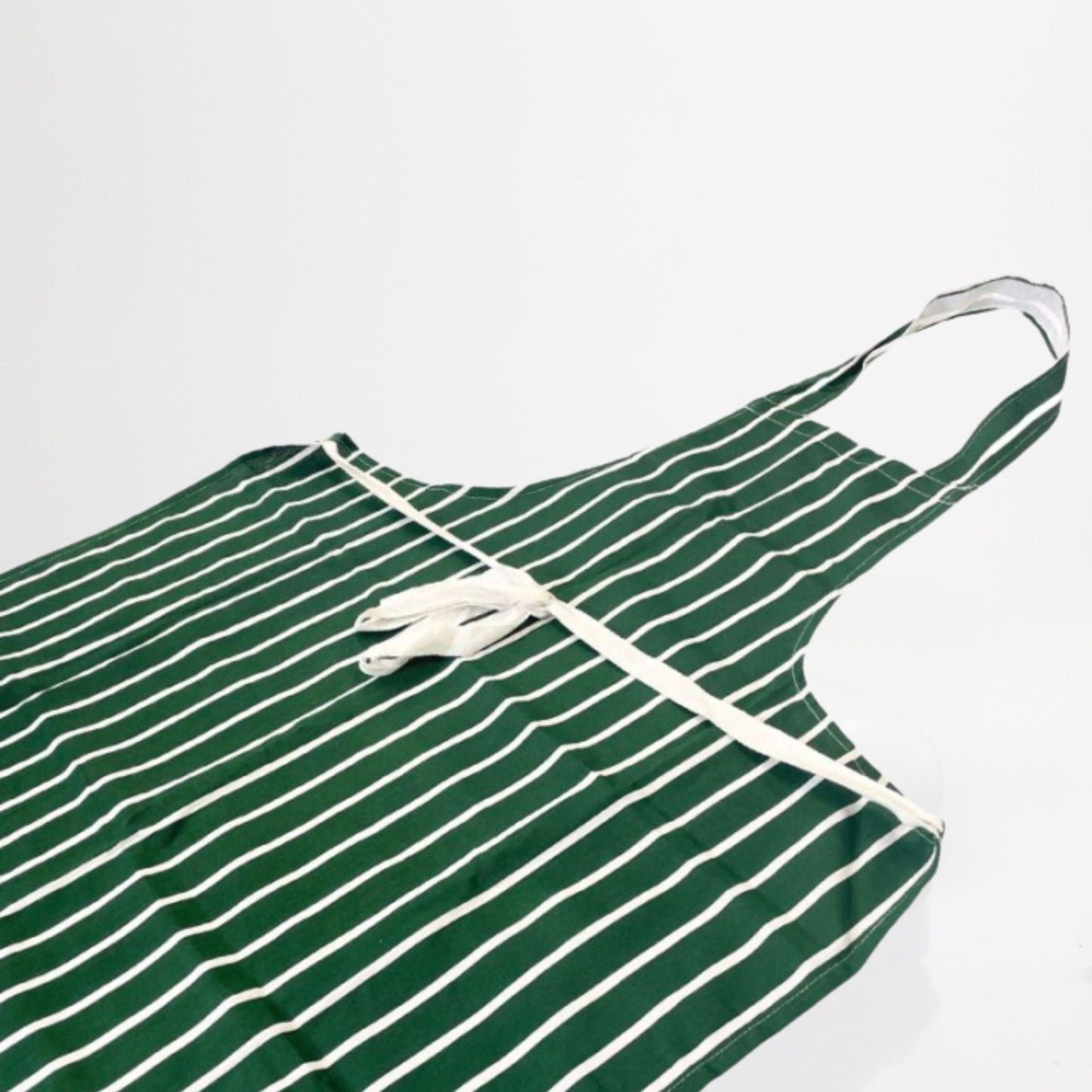 100% cotton, striped green and white classic chefs apron on white background.