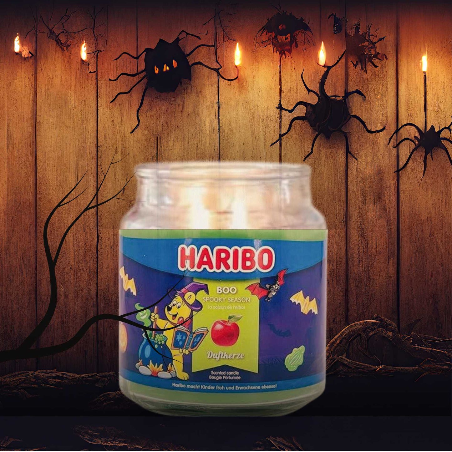 Haribo Halloween Candle with decorative lights and spider decorations on a wooden wall.