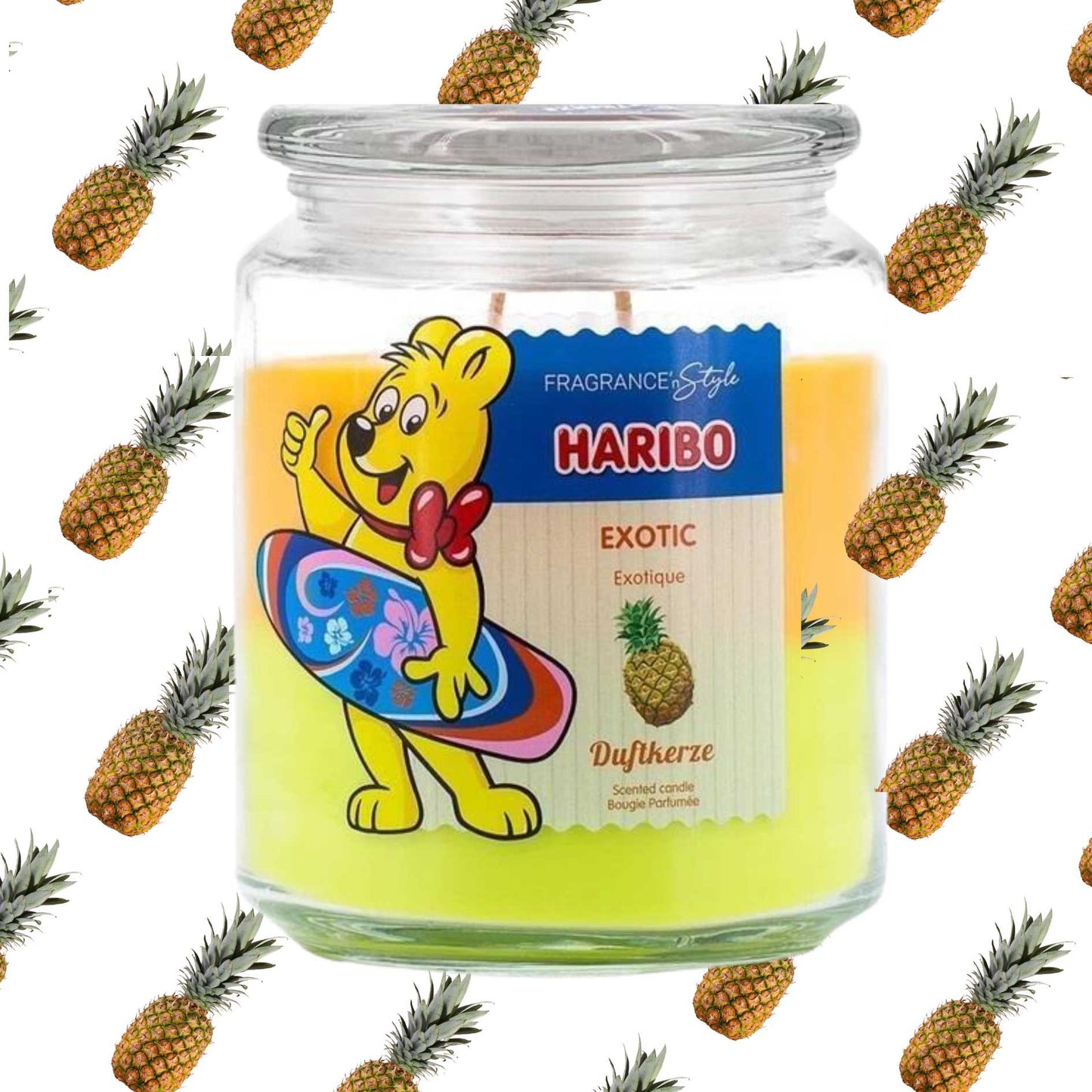 Haribo candle with a cartoon bear design surrounded by pineapples on a white background