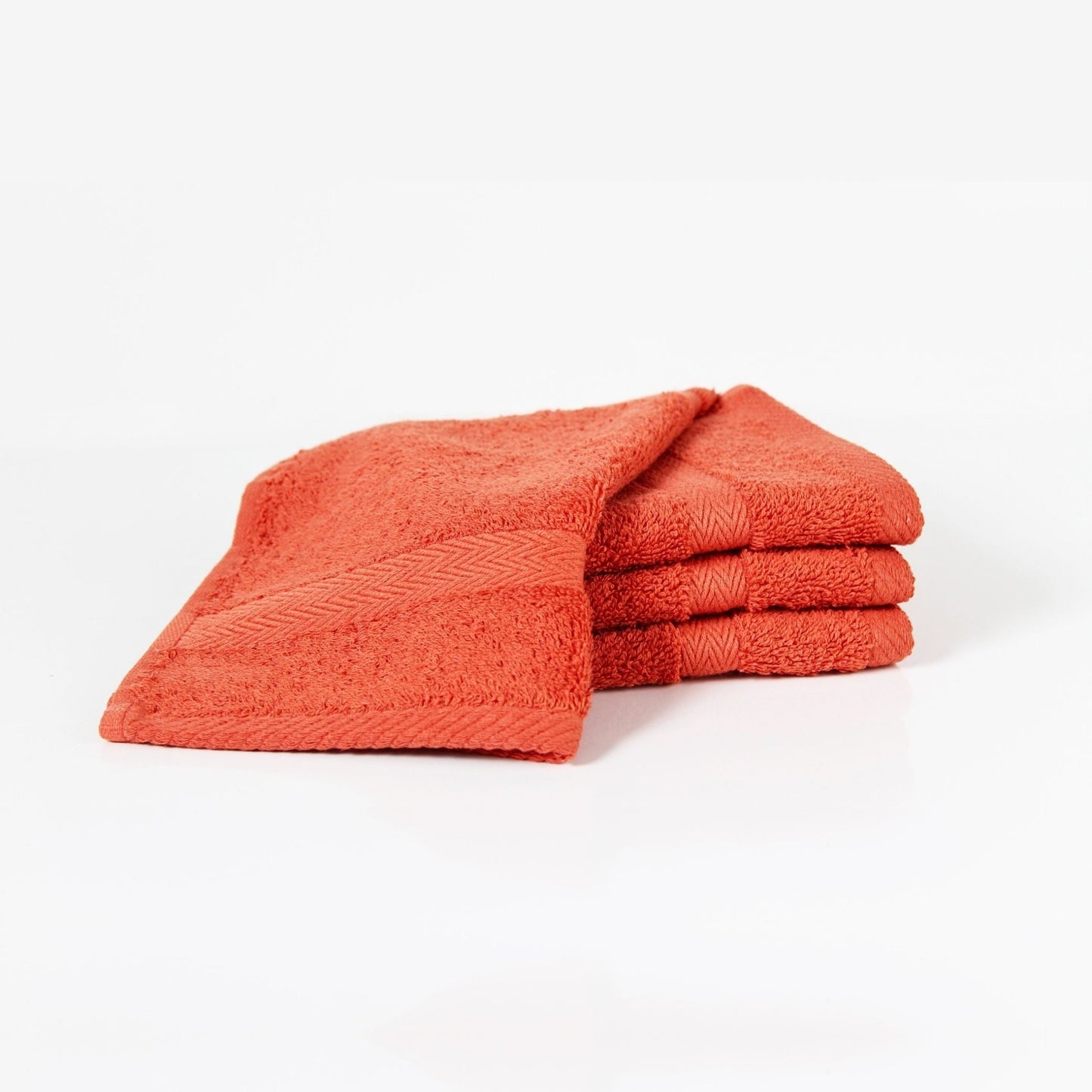 Luxury bathroom towel set in Paprika, made from soft fine combed cotton in a thick 600 GSM finish on a white background.