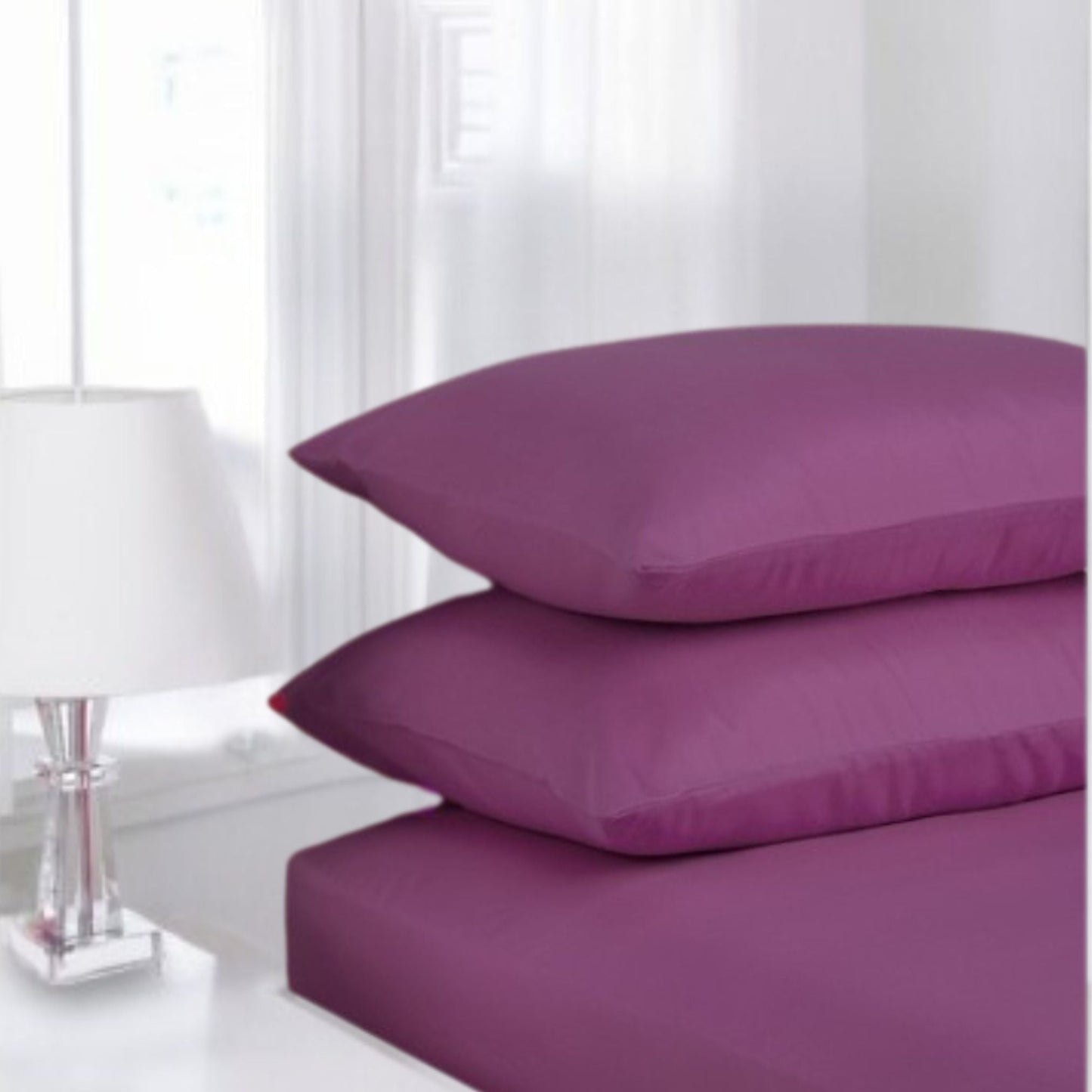 Purple Aubergine Percale pillowcase pair made from polycotton blend displayed in classic white guest room setting