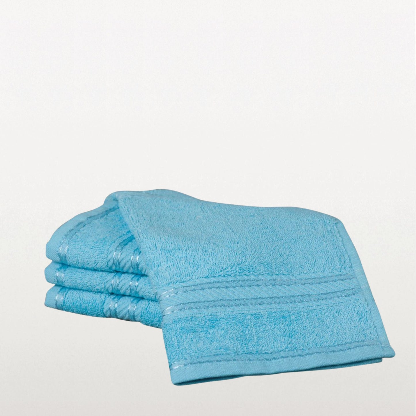 Aqua blue face towel on a light grey background