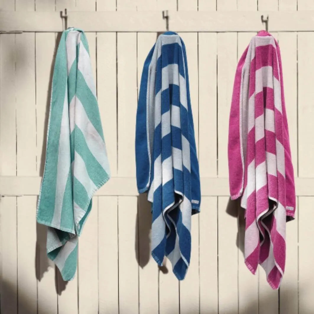 collection of three colourful beach towels