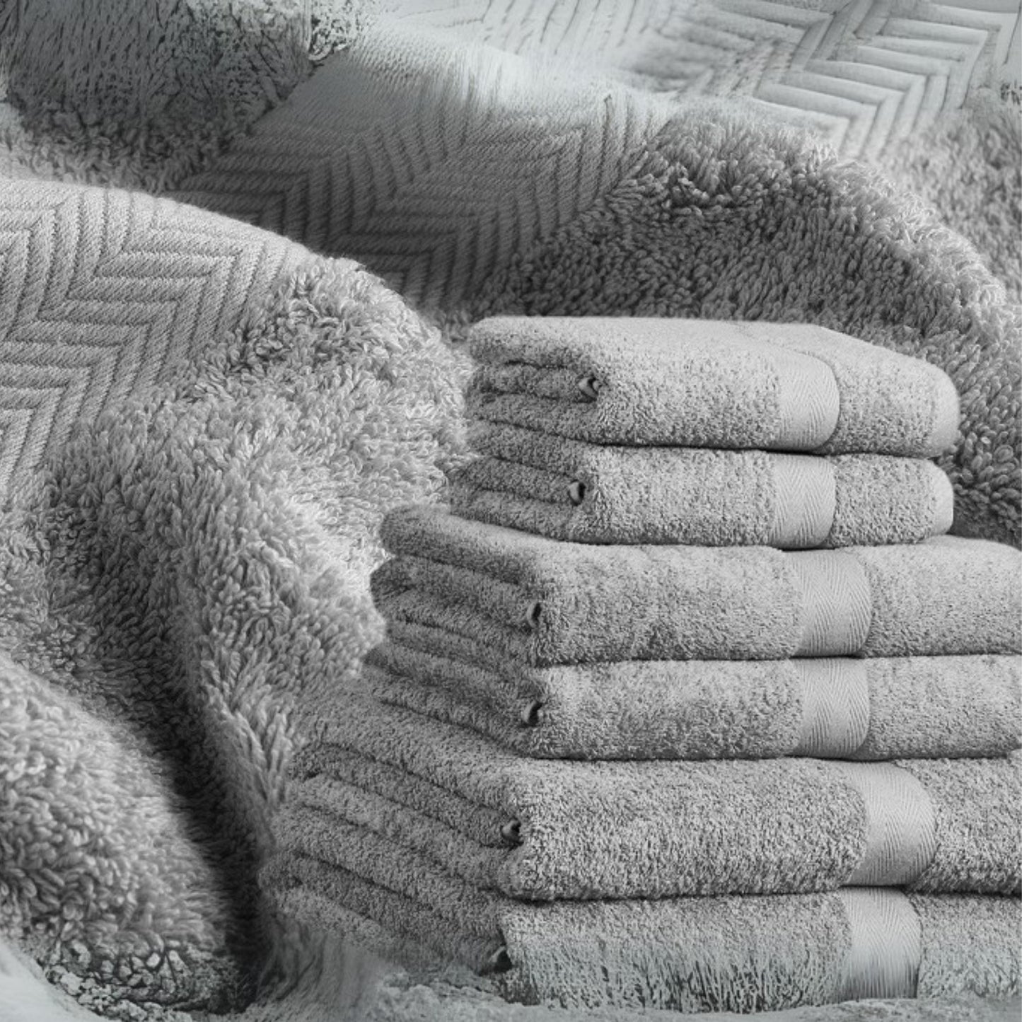 Silver grey bathroom towel, combed cotton, 500GSM, folded and stacked, luxury hotel quality.