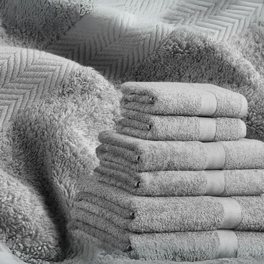 Silver grey bathroom towel, combed cotton, 500GSM, folded and stacked, luxury hotel quality.