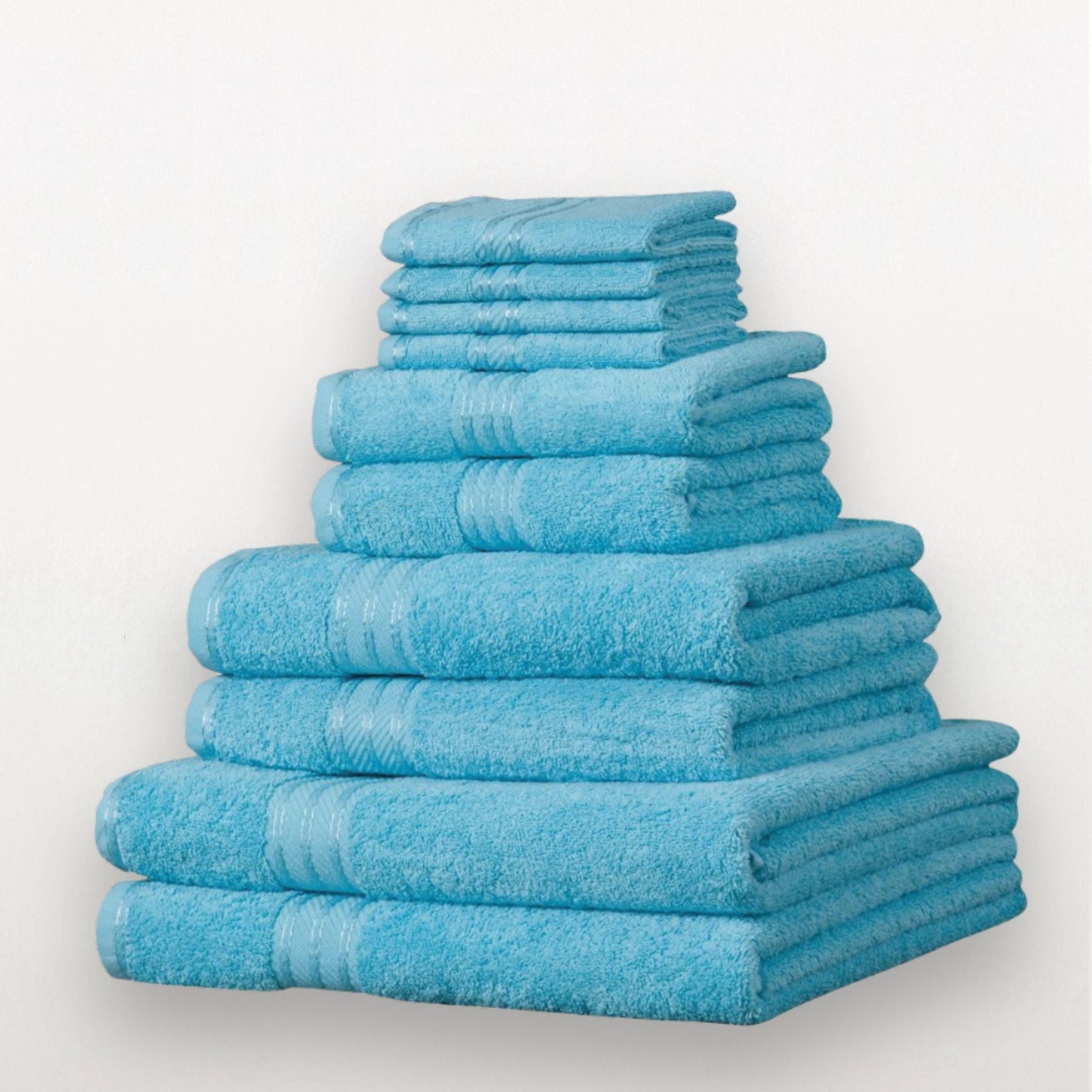 Stack of 500 GSM bathroom towels in aqua blue made from fine combed cotton on white background. 