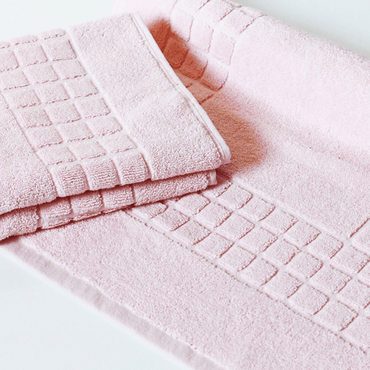 Blush Pink cotton bath mat with textured finish 