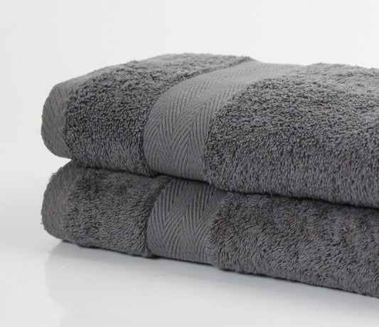 Pair of charcoal luxury bath sheets made from fine combed Cotton and 600GSM pile on white background