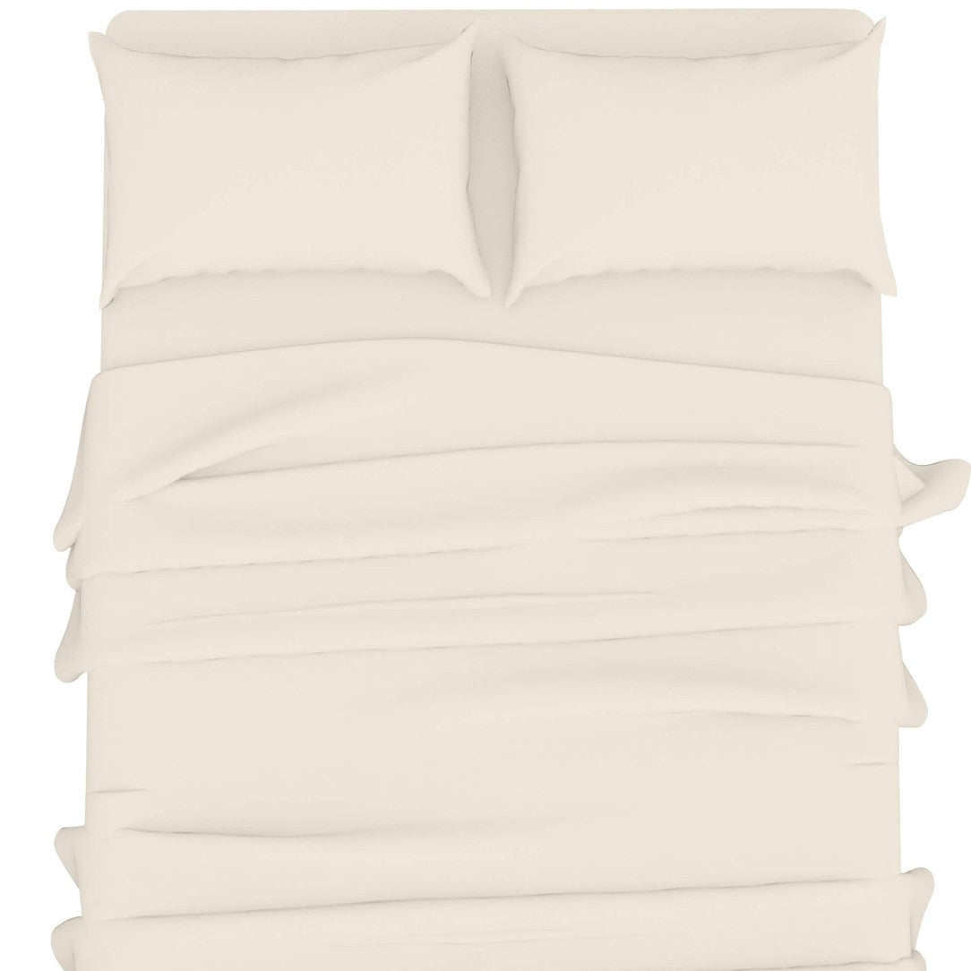 A top-down view of a bed made with a cream-colored duvet cover and two matching pillowcases, shown against a plain white background.