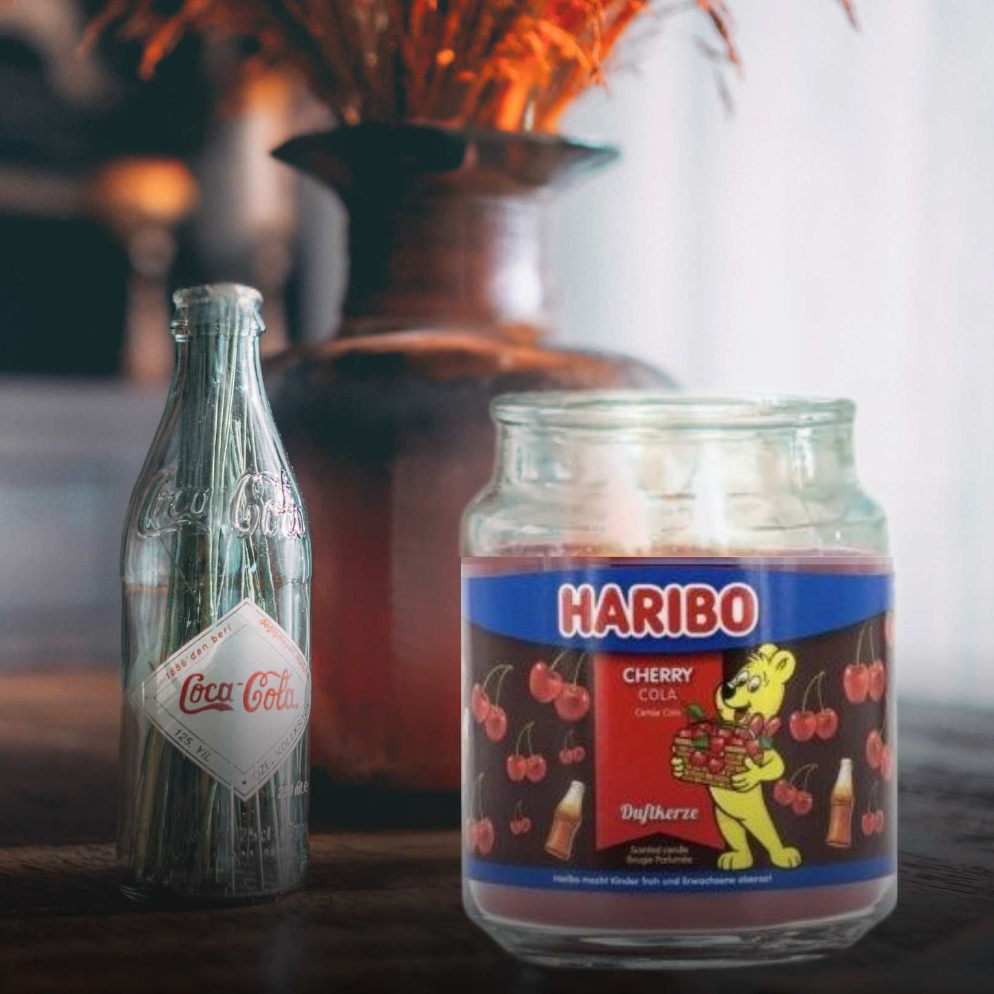 Coca-Cola bottle and Haribo jar on a table with a kitchen background