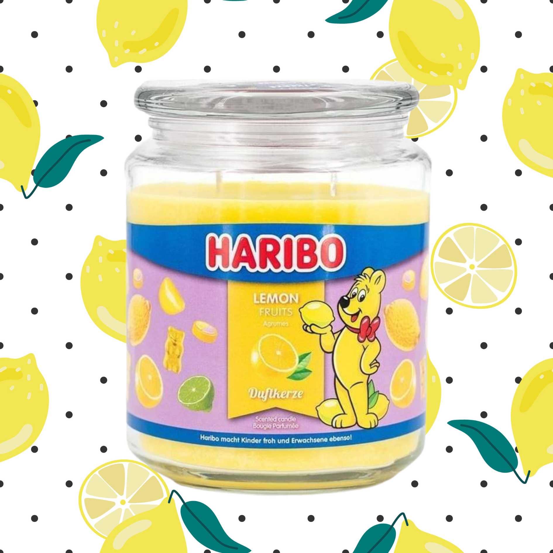 Haribo Lemon Fruits Candle on a polka dot background with lemons.