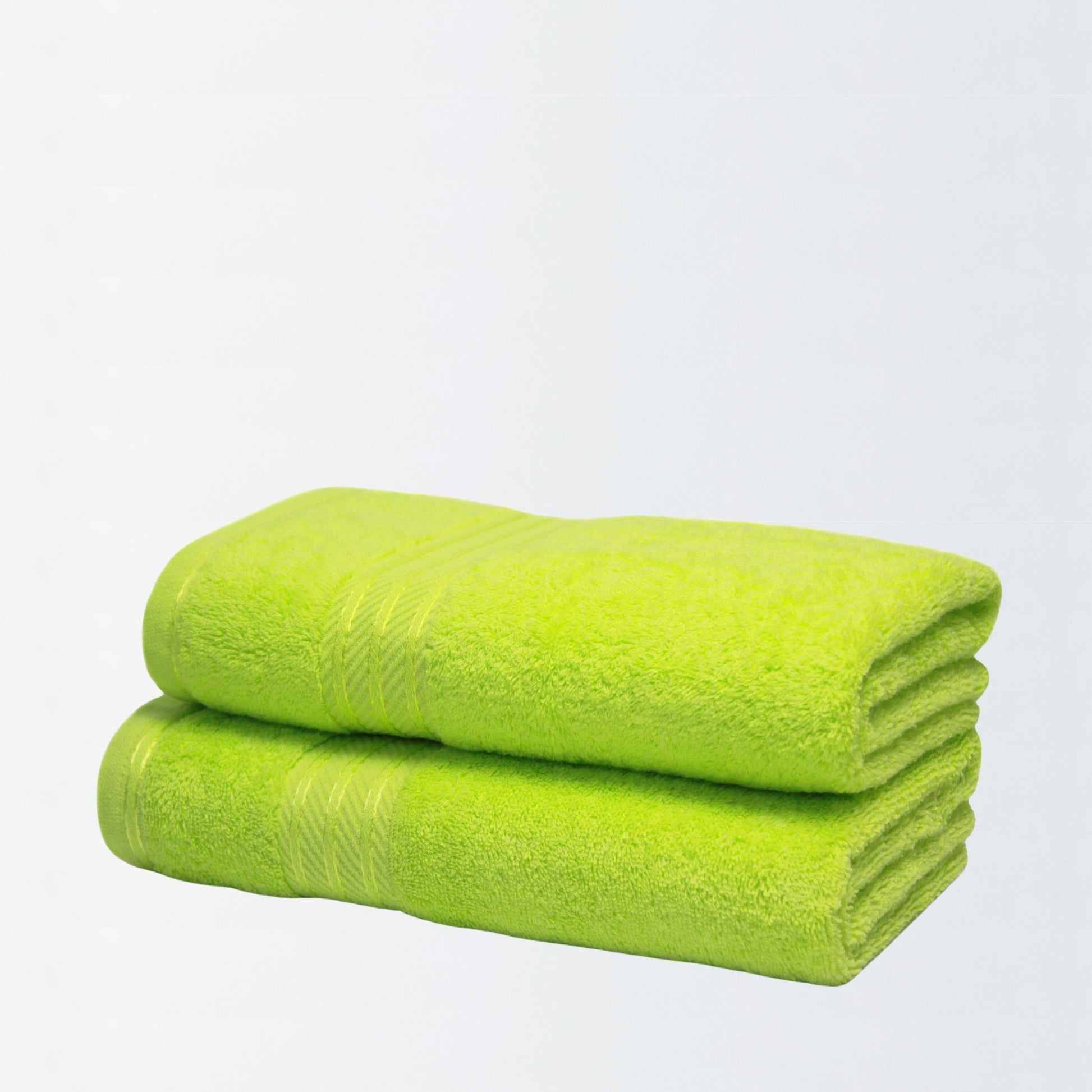 Pair of lime green cotton bathroom towels in 500gsm on white background.