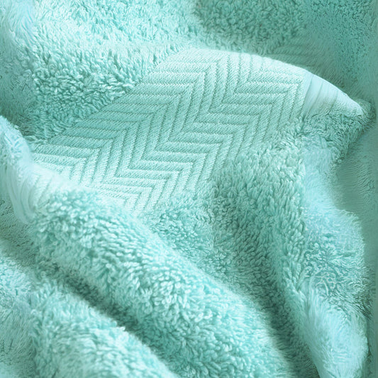 Seafoam blue bathroom towel, combed cotton, 500GSM, folded and stacked, luxury hotel quality.