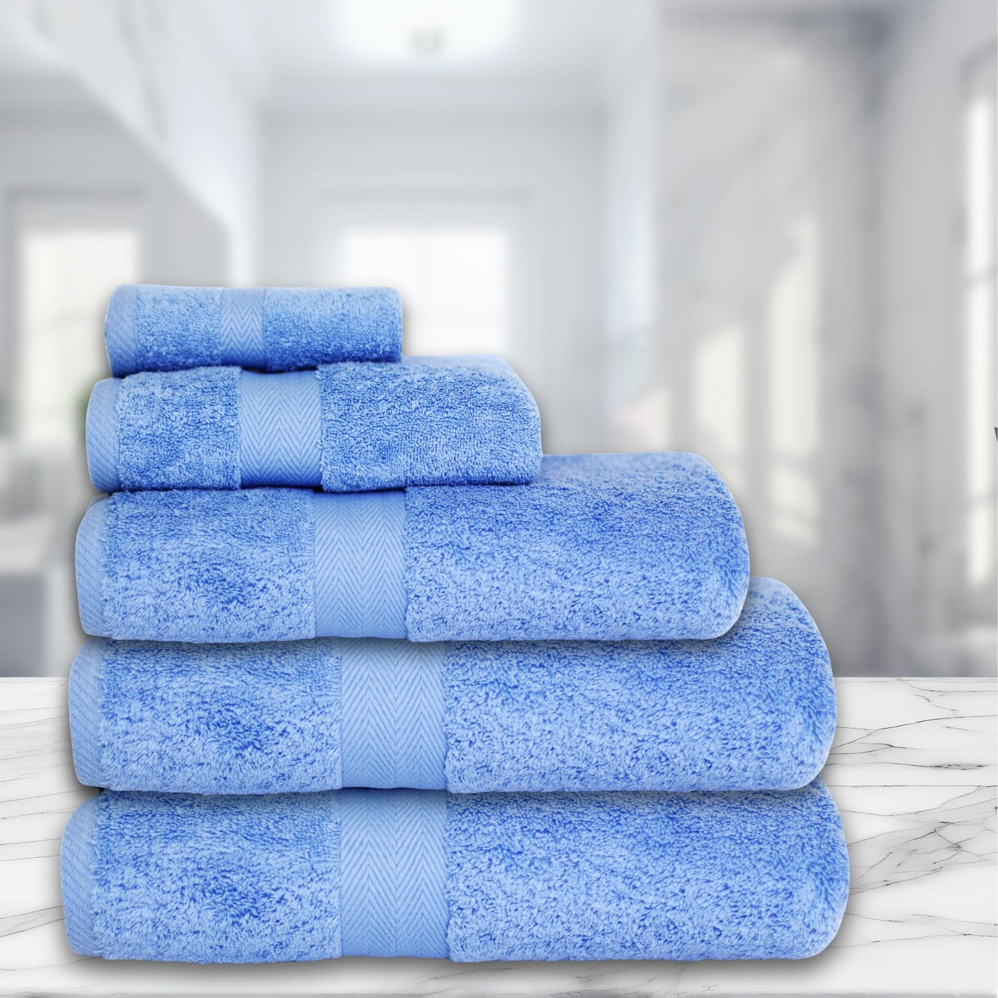 Cobalt Blue bathroom towel, combed cotton, 500GSM, folded and stacked, luxury hotel quality.