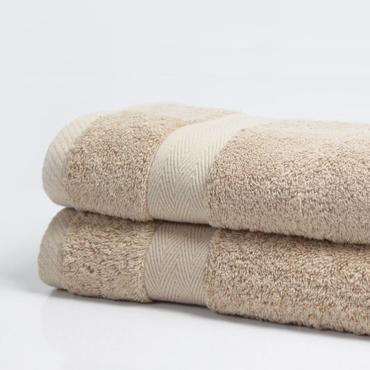 Neutral Beige bathroom towel, combed cotton, 500GSM, folded and stacked, luxury hotel quality.
