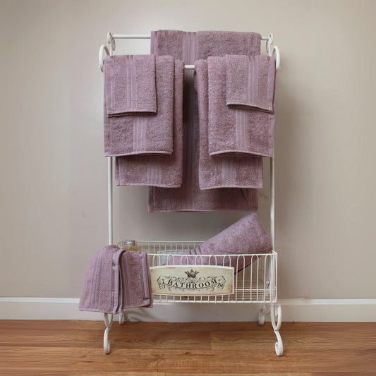 Purple Mauve Egyptian cotton bathroom towel, 500GSM, folded and stacked, luxury hotel quality.