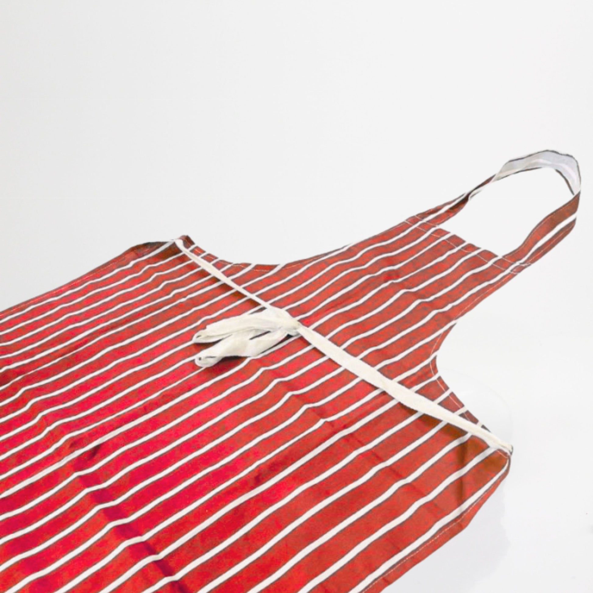 Red and white striped apron on a light gray background