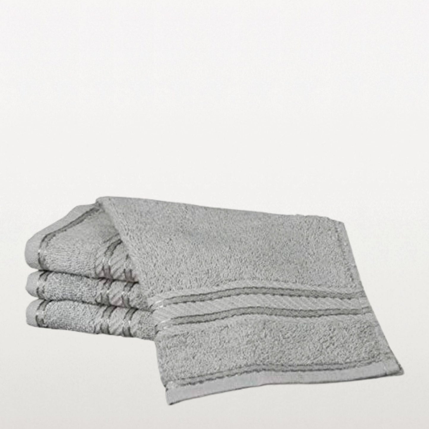 Stack of grey face towels on a white background