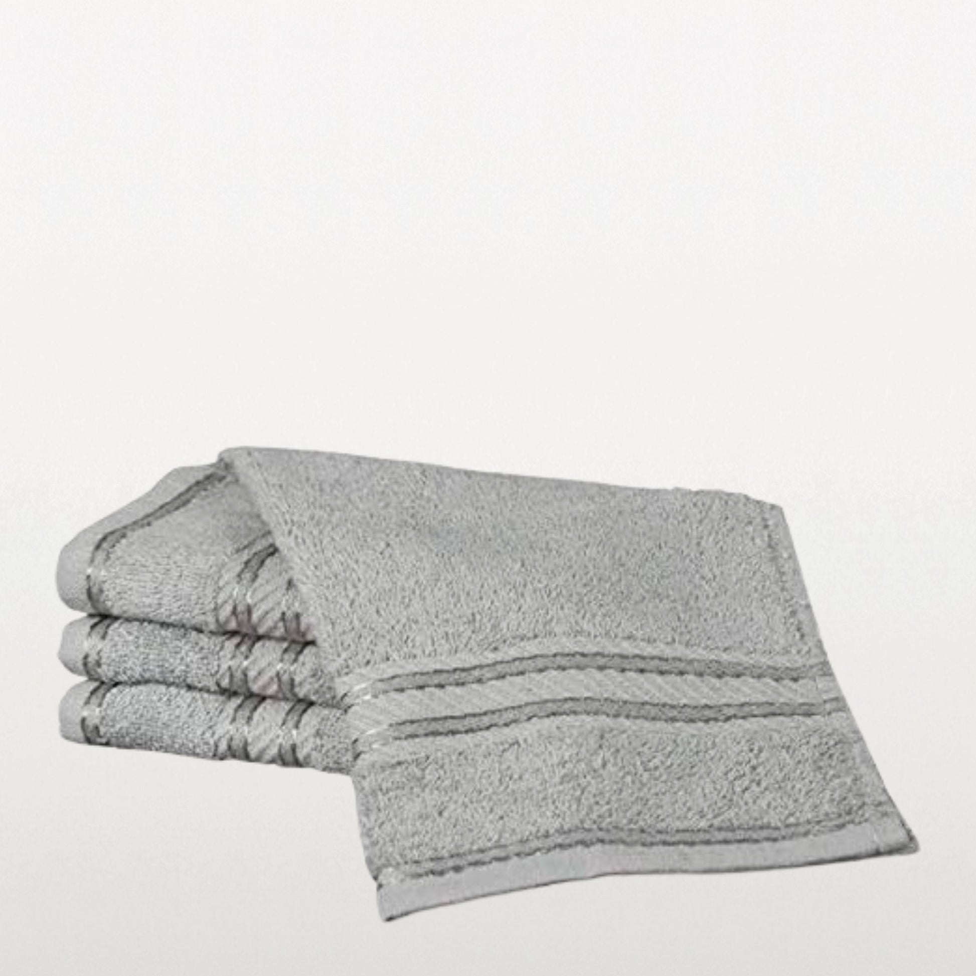 Stack of grey face towels on a white background
