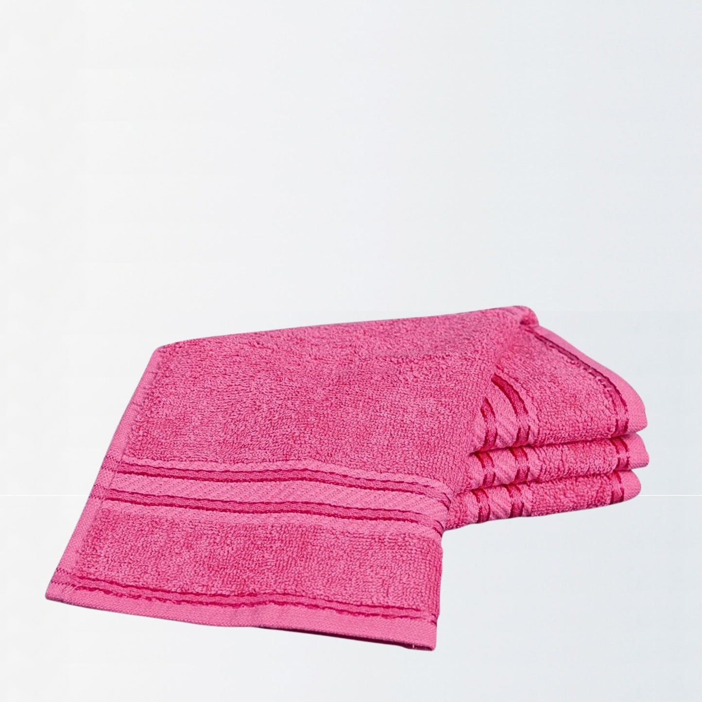 Pink face towel on a light grey background