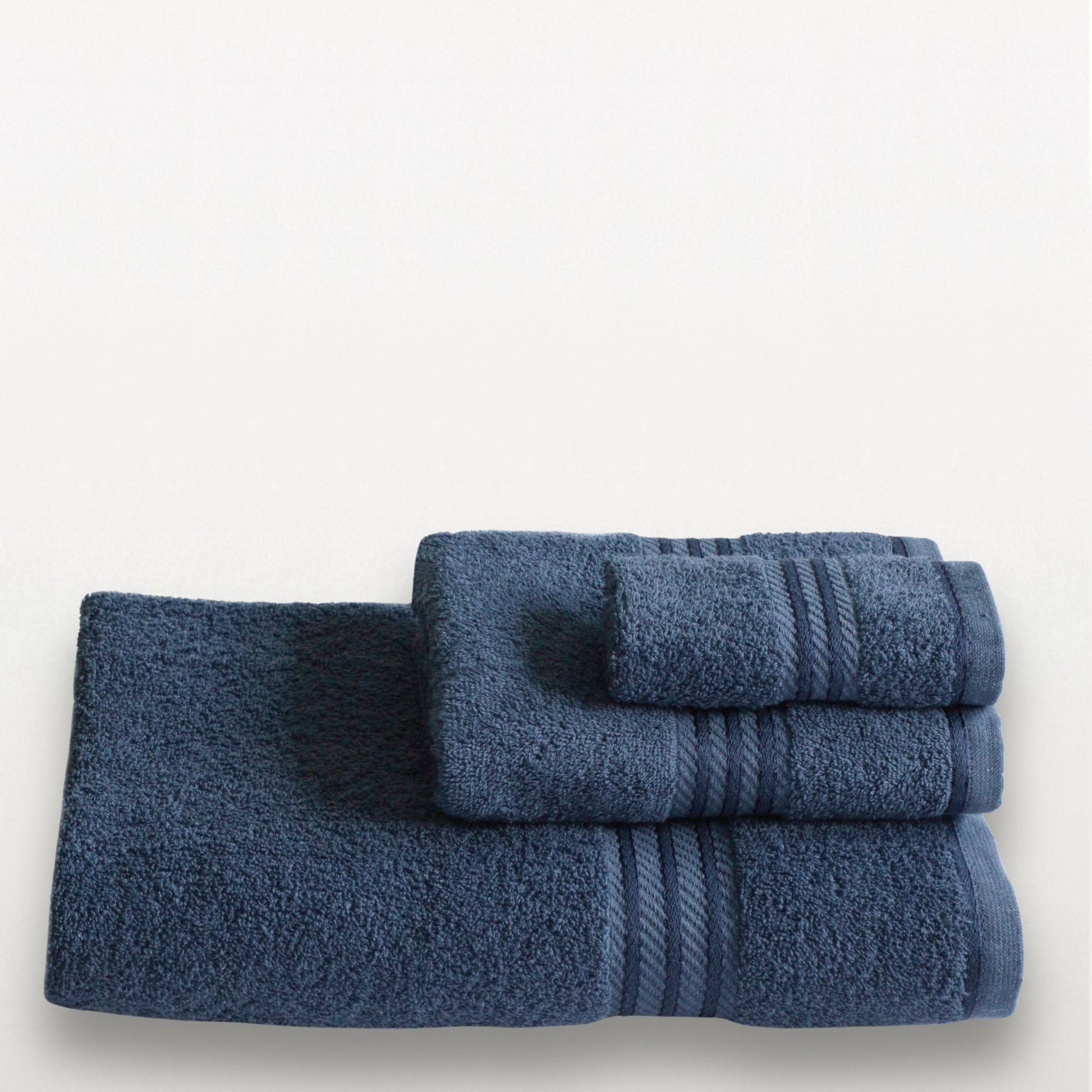 Set of blue towels on a white background