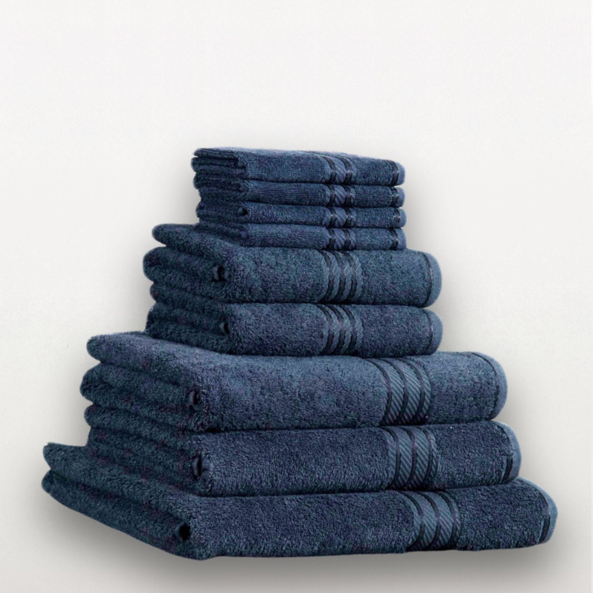 Stack of blue towels on a light gray background