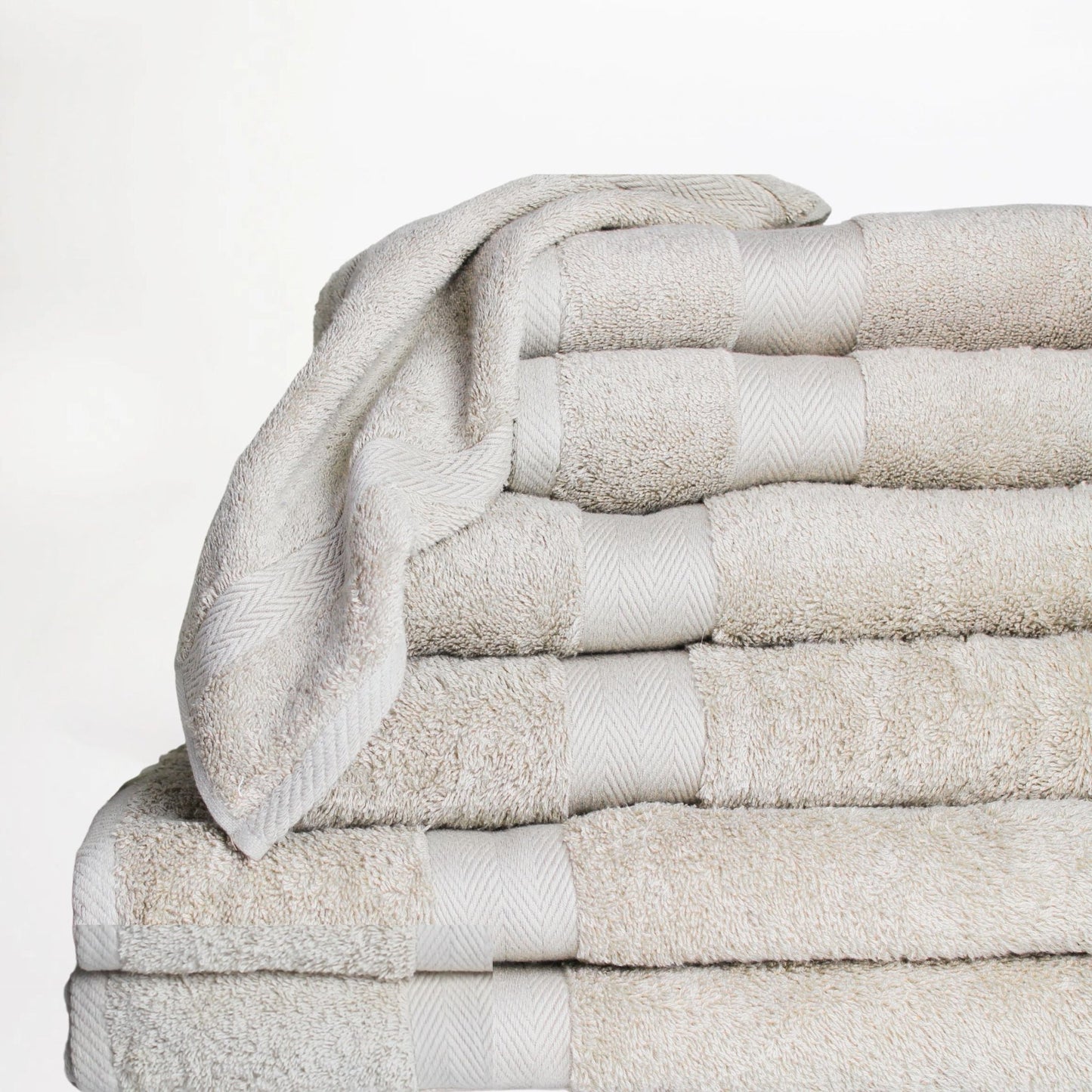 Stack of stone coloured Luxury Bathroom Towels made from fine combed cotton with 600 GSM pile