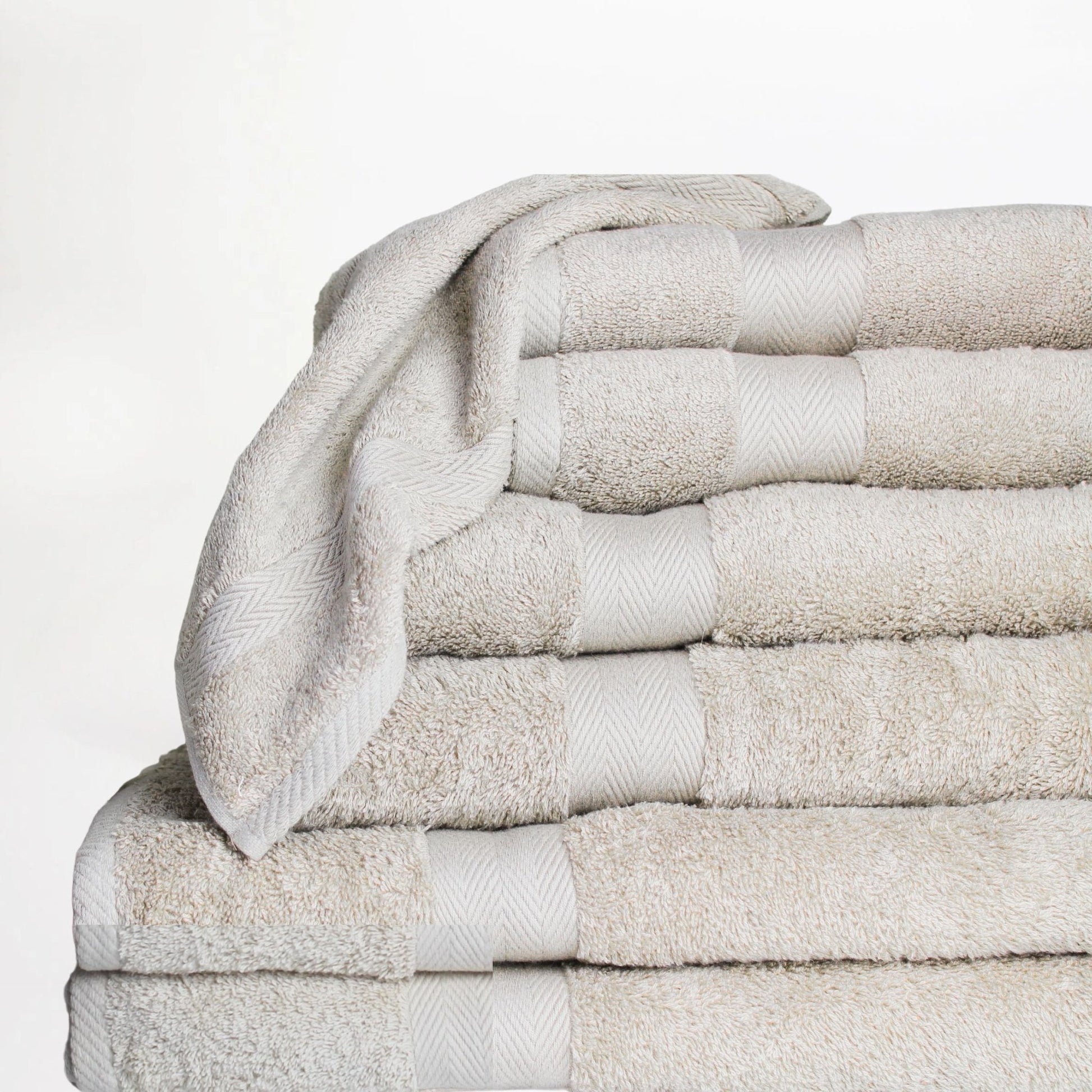Stack of stone coloured Luxury Bathroom Towels made from fine combed cotton with 600 GSM pile